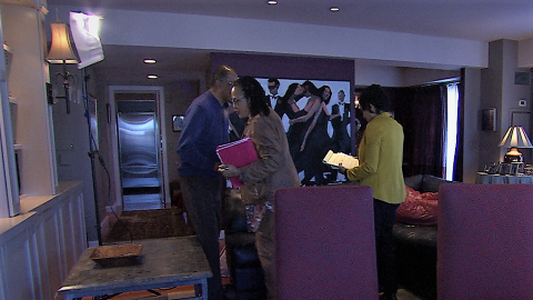 Wayne Budd asks last-minute questions of Valerie Whitmore and crew.